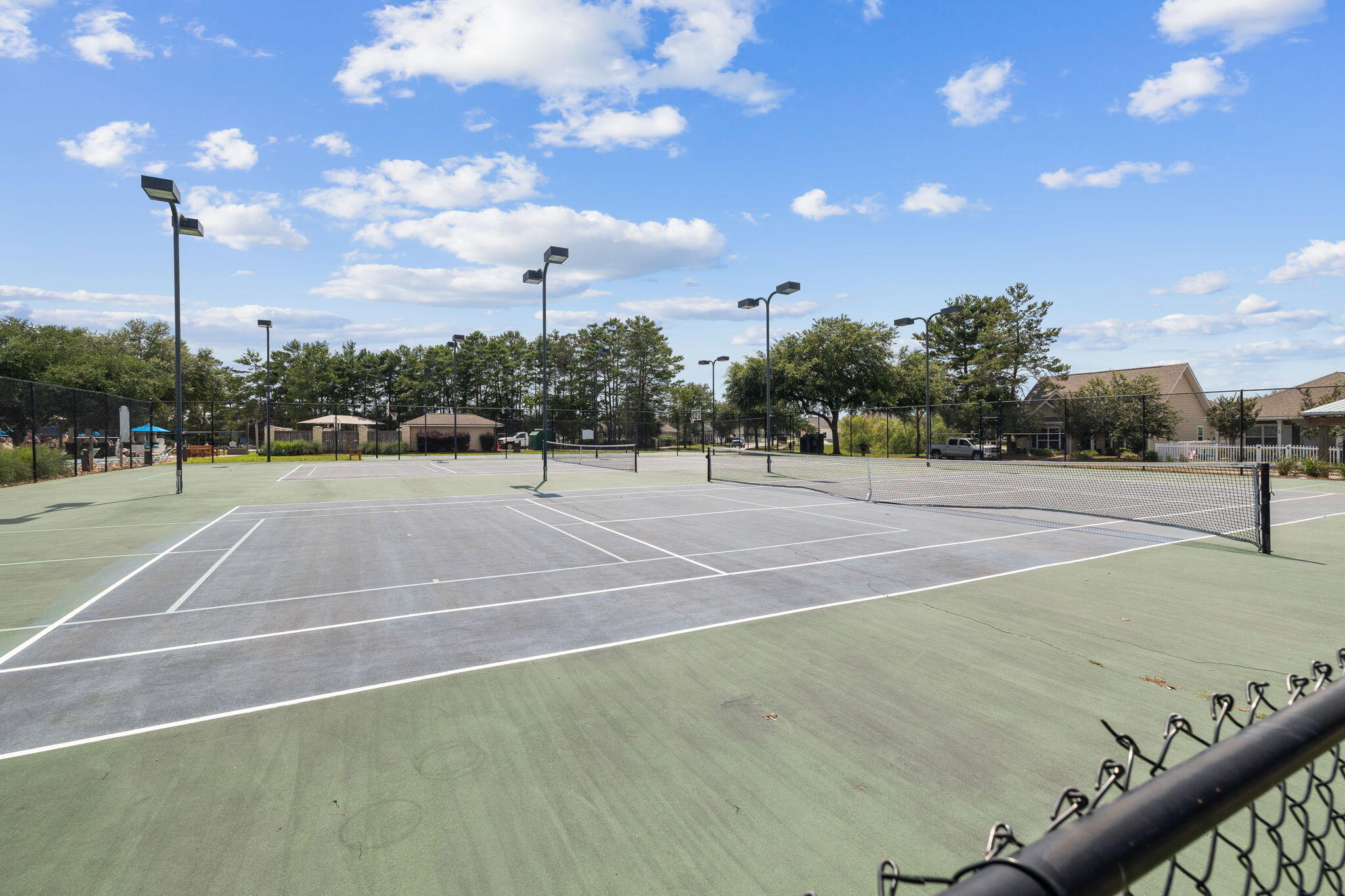 59 Echo Cove Freeport, FL 32439 - Photo 29 of 32 a tennis court with view of palm trees