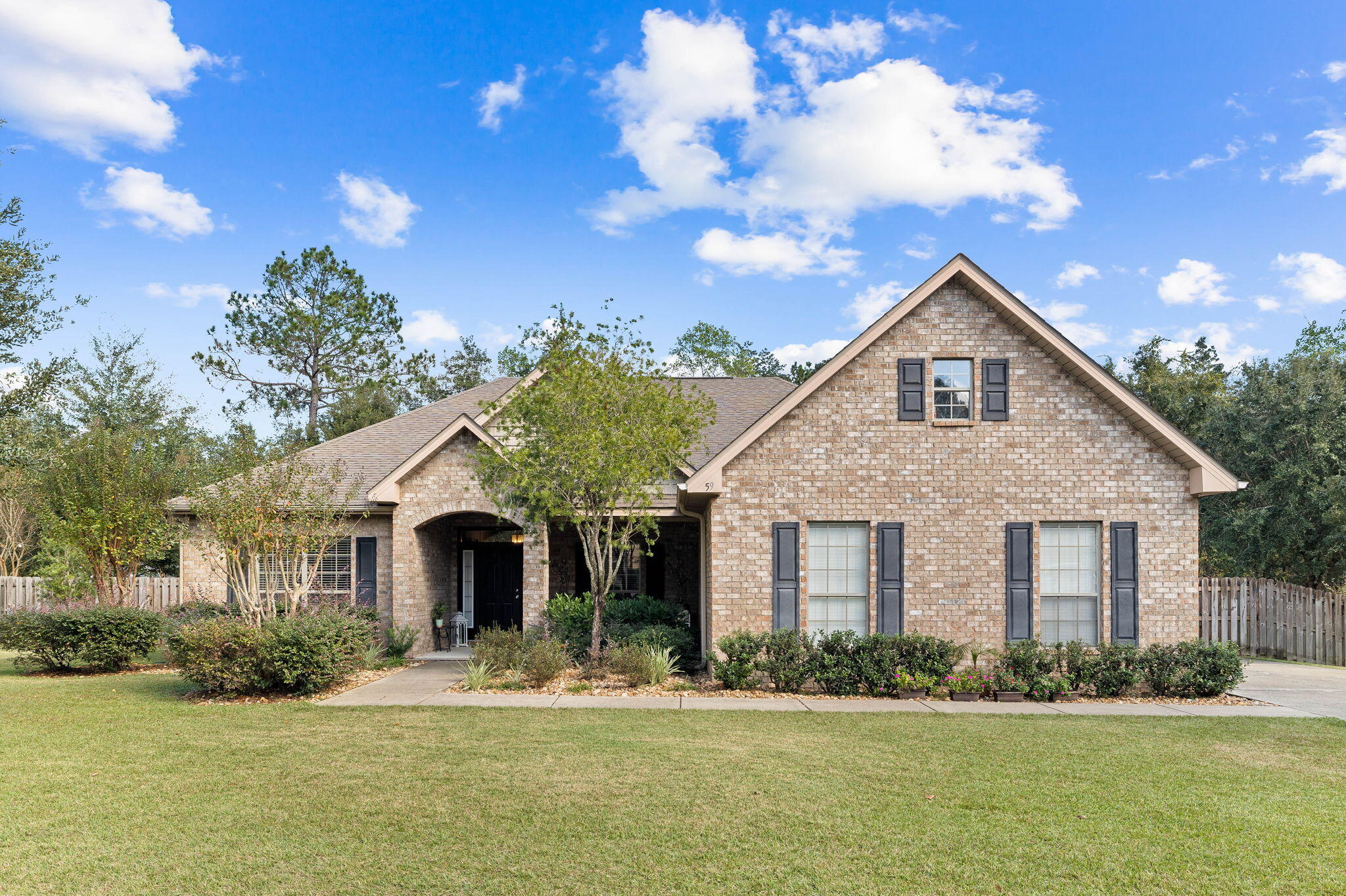 59 Echo Cove Freeport, FL 32439 - Photo 32 of 32 a front view of a house with a yard