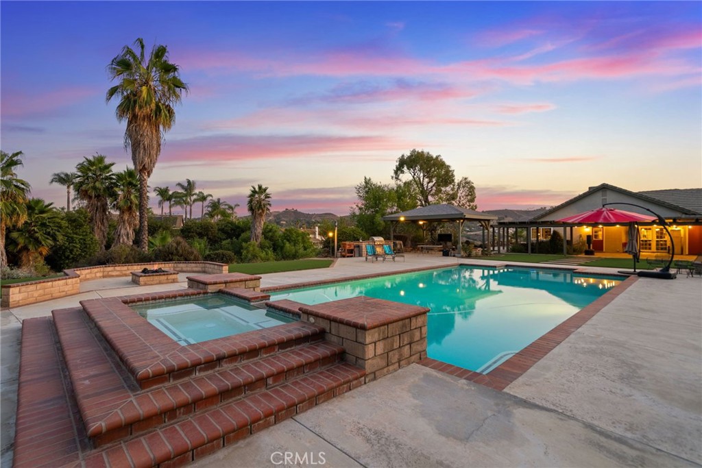 a view of a patio with swimming pool
