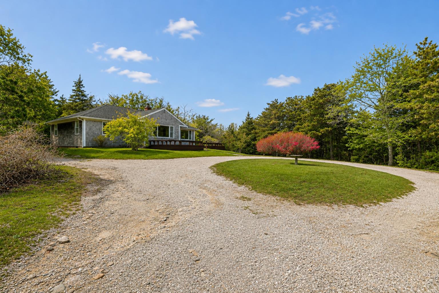 10 Pease Point Road Edgartown, MA 02539 - Photo 4 of 21 a view of a house with a big yard and potted plants