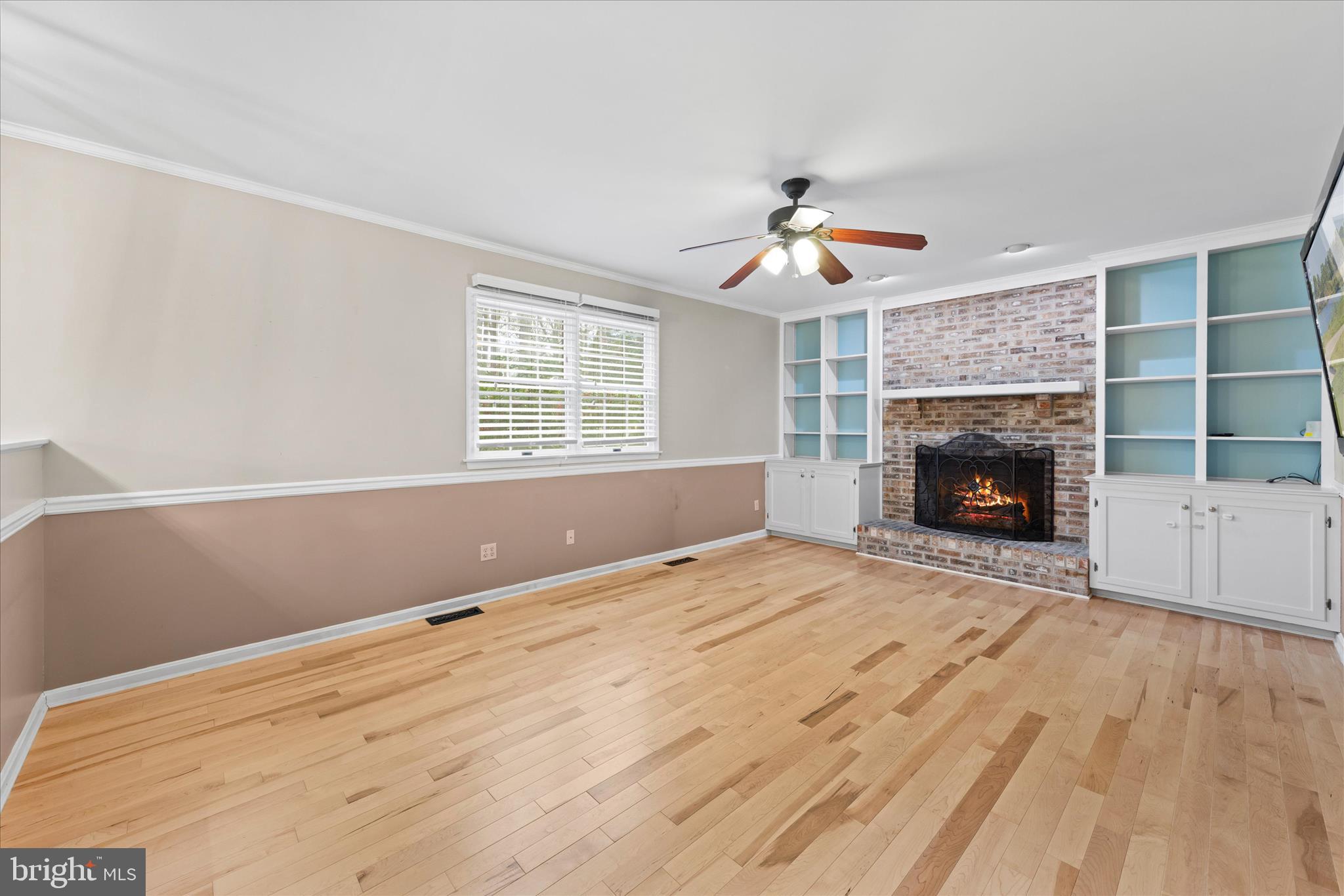 30398 Southampton Bridge Road Salisbury, MD 21804 - Photo 18 of 76 a view of an empty room with wooden floor fireplace and a window