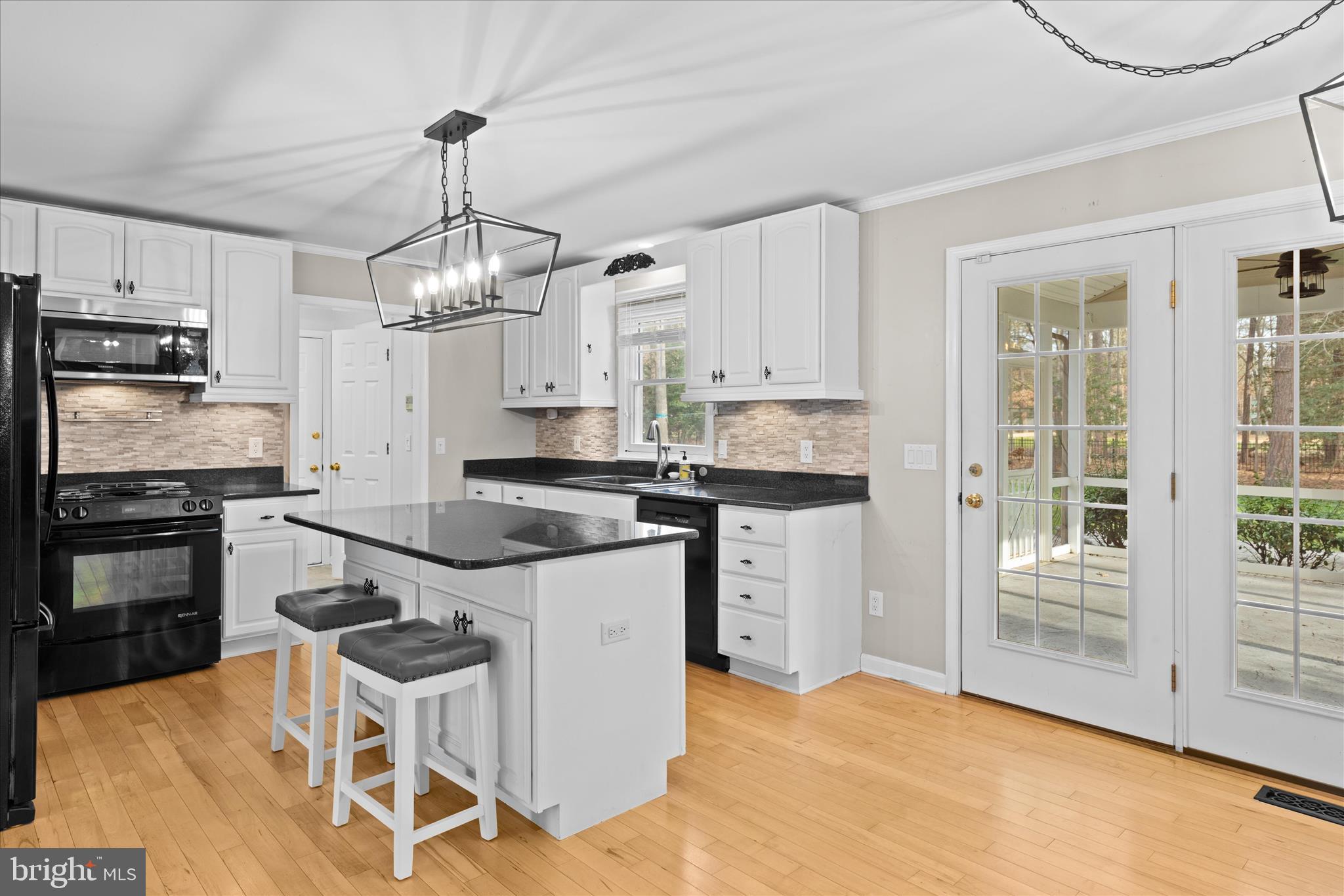 30398 Southampton Bridge Road Salisbury, MD 21804 - Photo 21 of 76 a kitchen with stainless steel appliances granite countertop a stove top oven a refrigerator a sink and a stove