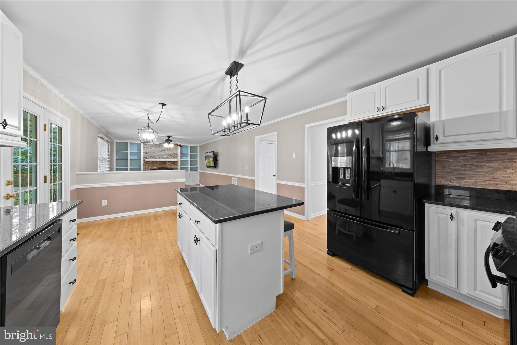 30398 Southampton Bridge Road Salisbury, MD 21804 - Photo 26 of 76 a kitchen with stainless steel appliances granite countertop a refrigerator a stove and a wooden floors