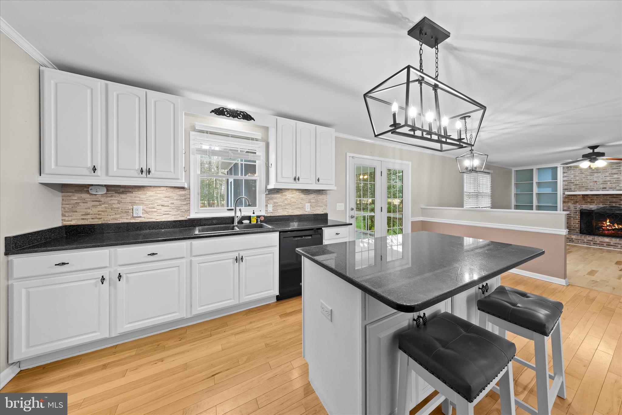 30398 Southampton Bridge Road Salisbury, MD 21804 - Photo 27 of 76 a kitchen with stainless steel appliances granite countertop a stove a sink dishwasher and cabinets with wooden floor