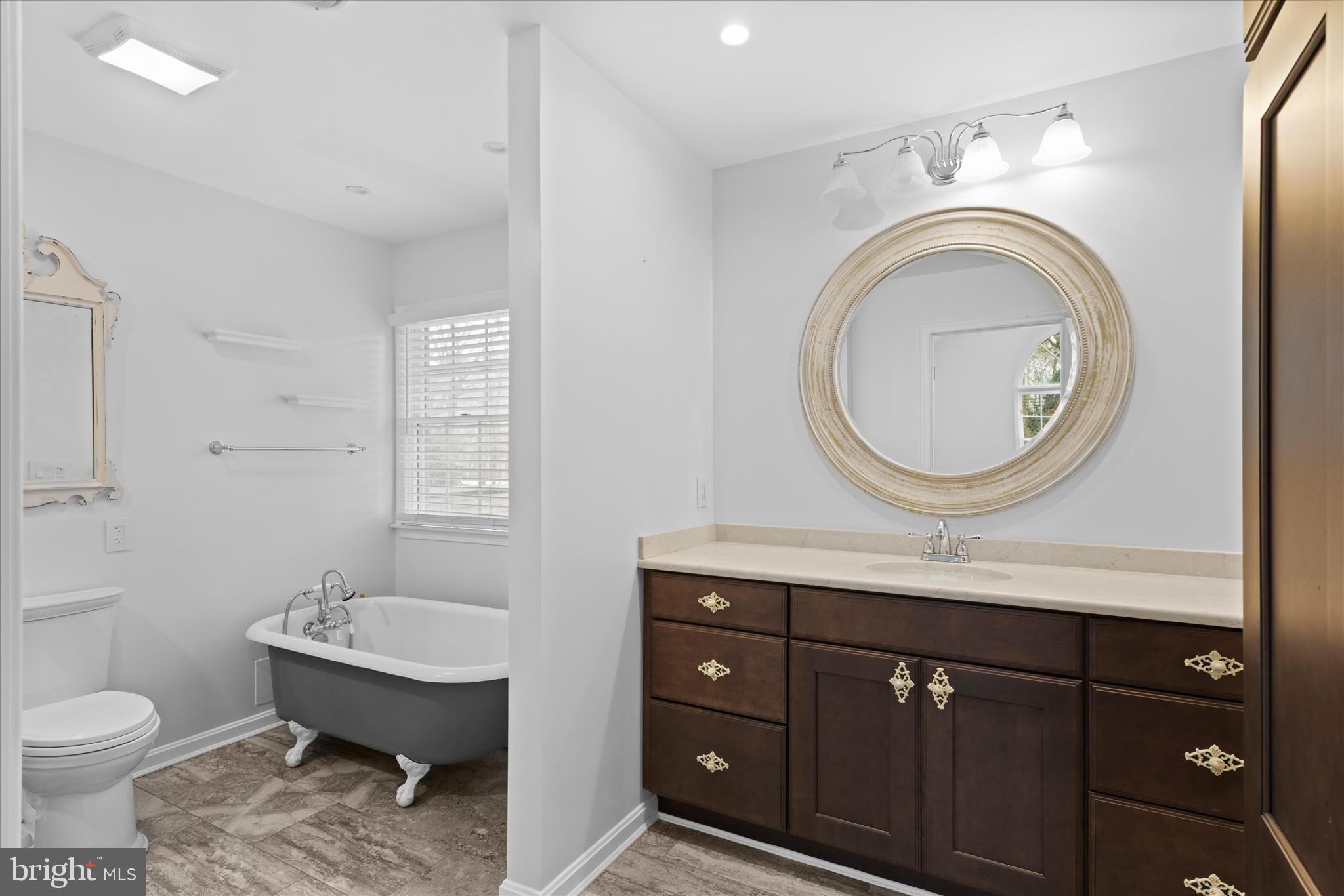 30398 Southampton Bridge Road Salisbury, MD 21804 - Photo 52 of 76 a bathroom with a toilet a sink and mirror