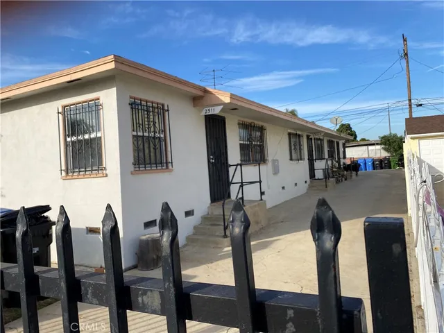 a view of a dining room with furniture and floor to ceiling window