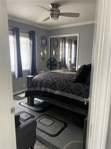 a bedroom with a bed and window