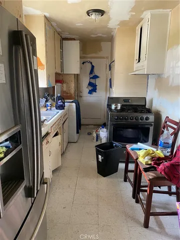 a kitchen with a wooden cabinets and a stove top oven