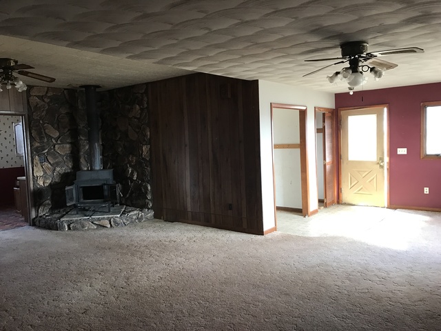 564 Base Line Road Walnut, IL 61376 - Photo 11 of 20 a view of a livingroom with furniture and a window