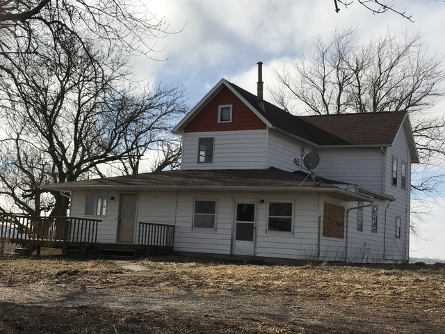 564 Base Line Road Walnut, IL 61376 - Photo 4 of 20 a front view of a house with a yard