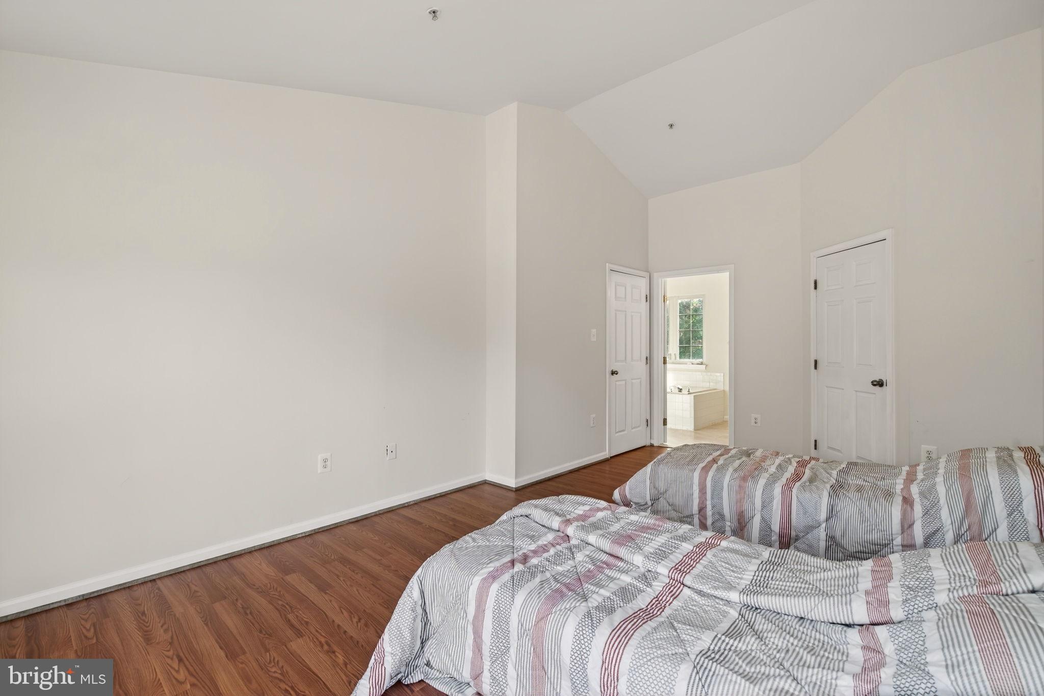 6903 Bock Road Fort Washington, MD 20744 - Photo 25 of 62 a bedroom with a bed and painting on the wall