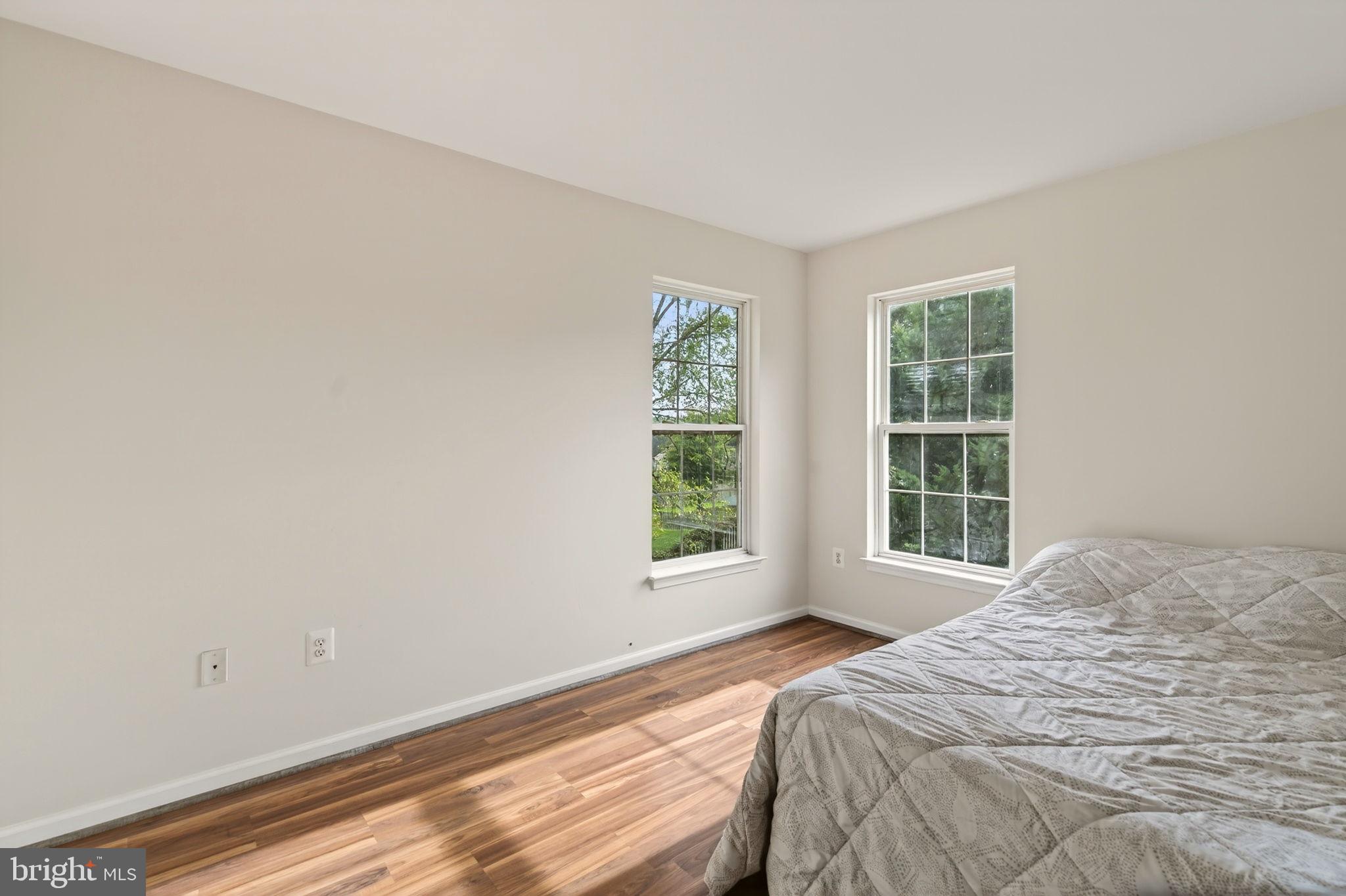 6903 Bock Road Fort Washington, MD 20744 - Photo 26 of 62 a bed sitting in a bedroom next to a window