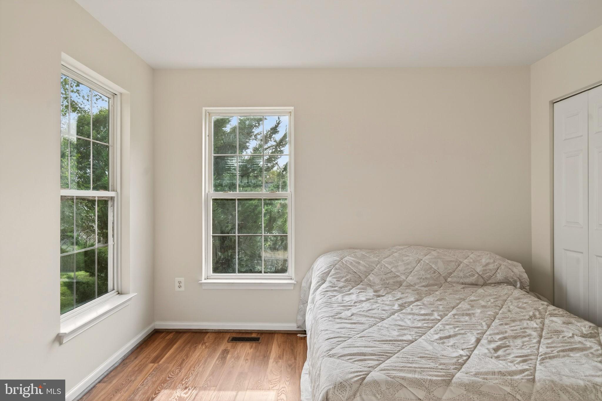 6903 Bock Road Fort Washington, MD 20744 - Photo 27 of 62 a bedroom with a bed and wooden floor