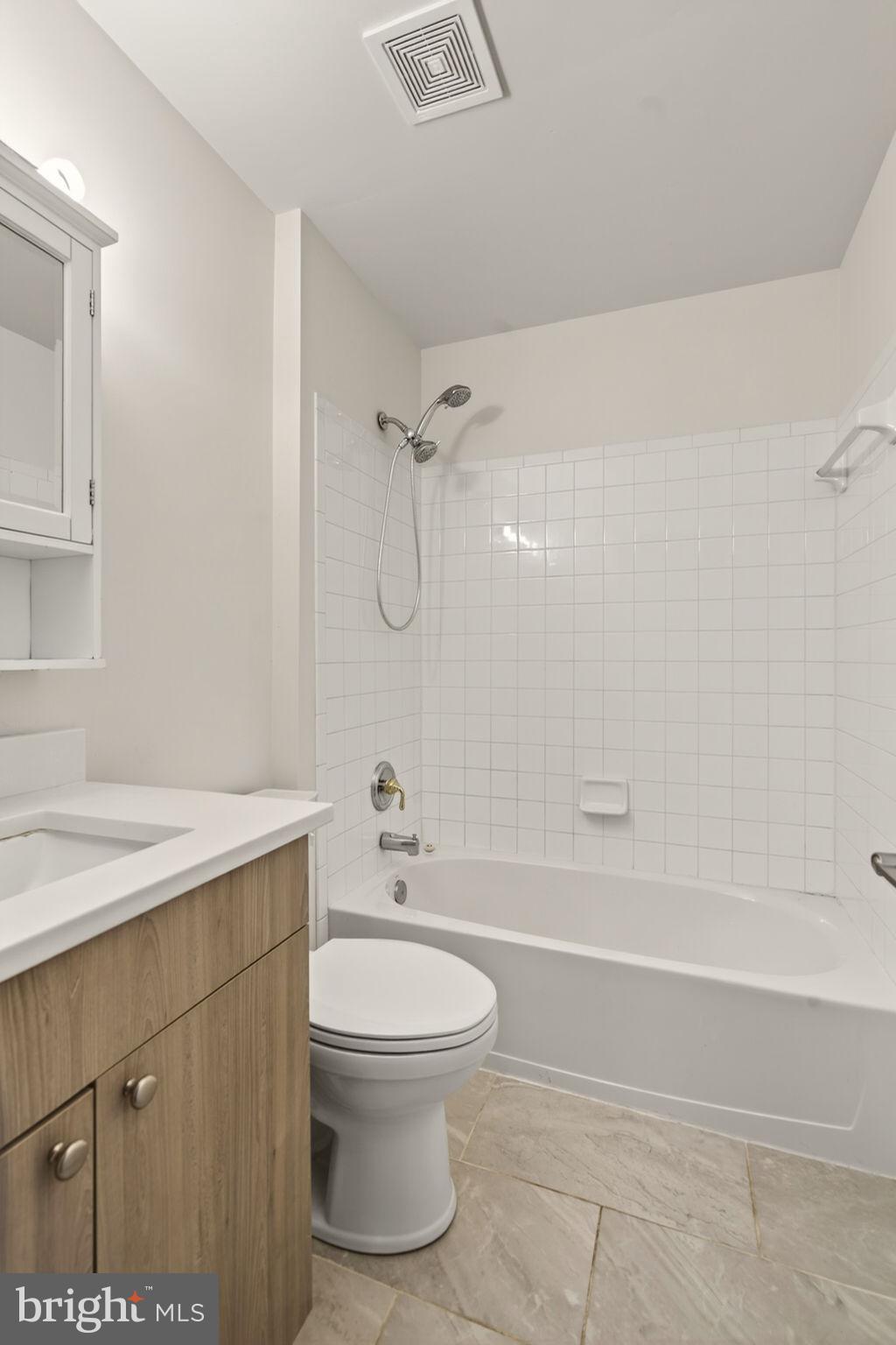 6903 Bock Road Fort Washington, MD 20744 - Photo 29 of 62 a bathroom with a sink a toilet and shower