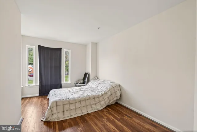 a view of a dining room with furniture and a window