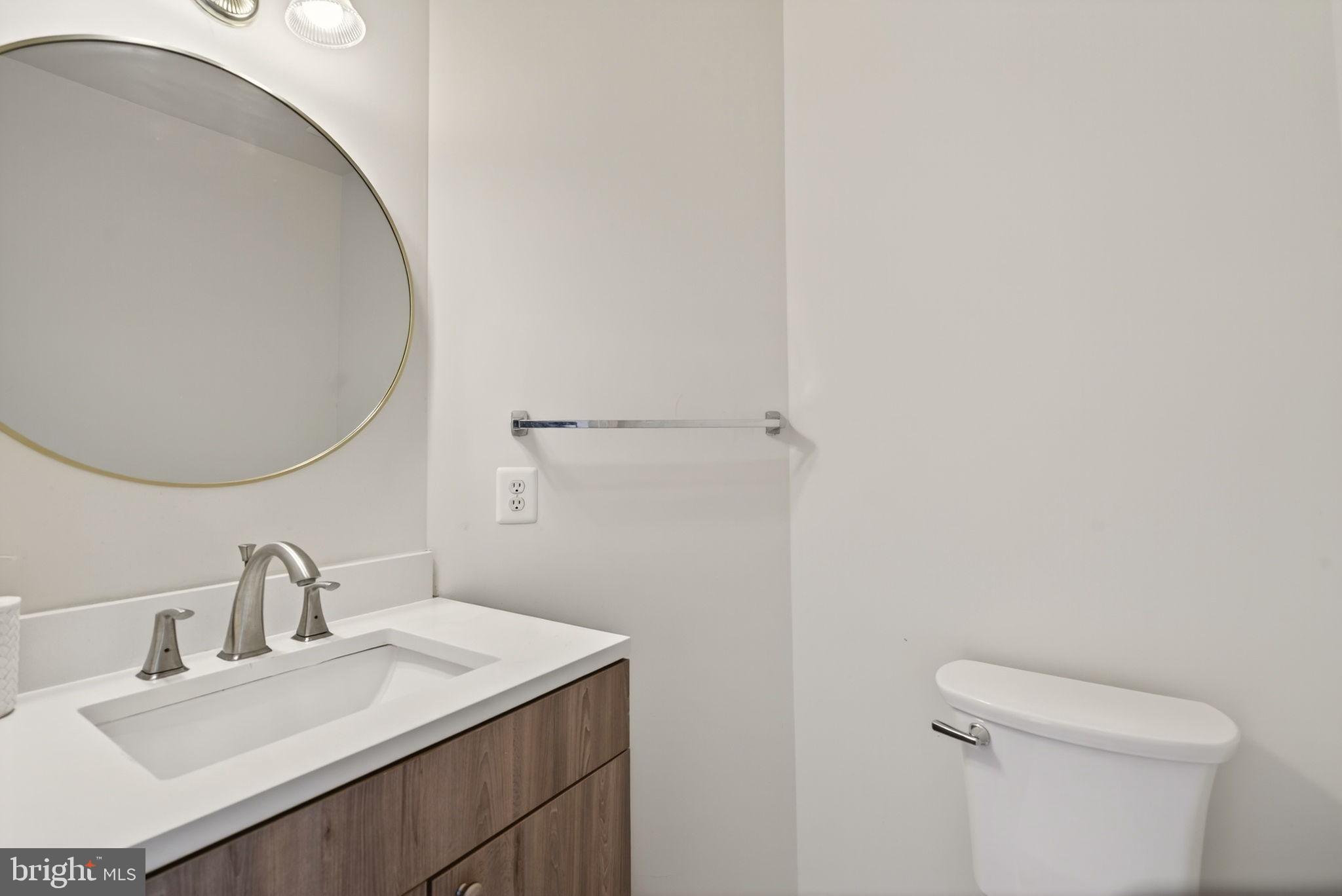 6903 Bock Road Fort Washington, MD 20744 - Photo 43 of 62 a bathroom with a sink and a mirror