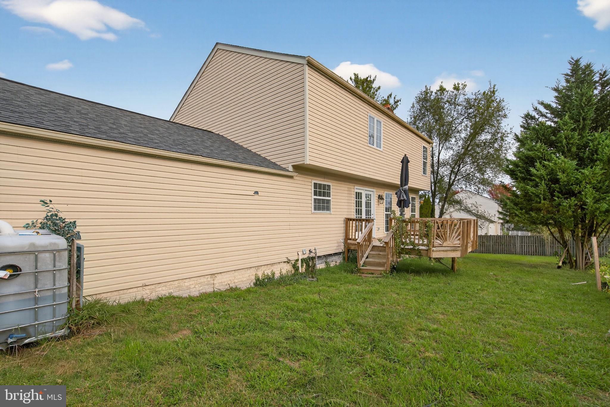 6903 Bock Road Fort Washington, MD 20744 - Photo 5 of 62 a view of a house with a yard and sitting area