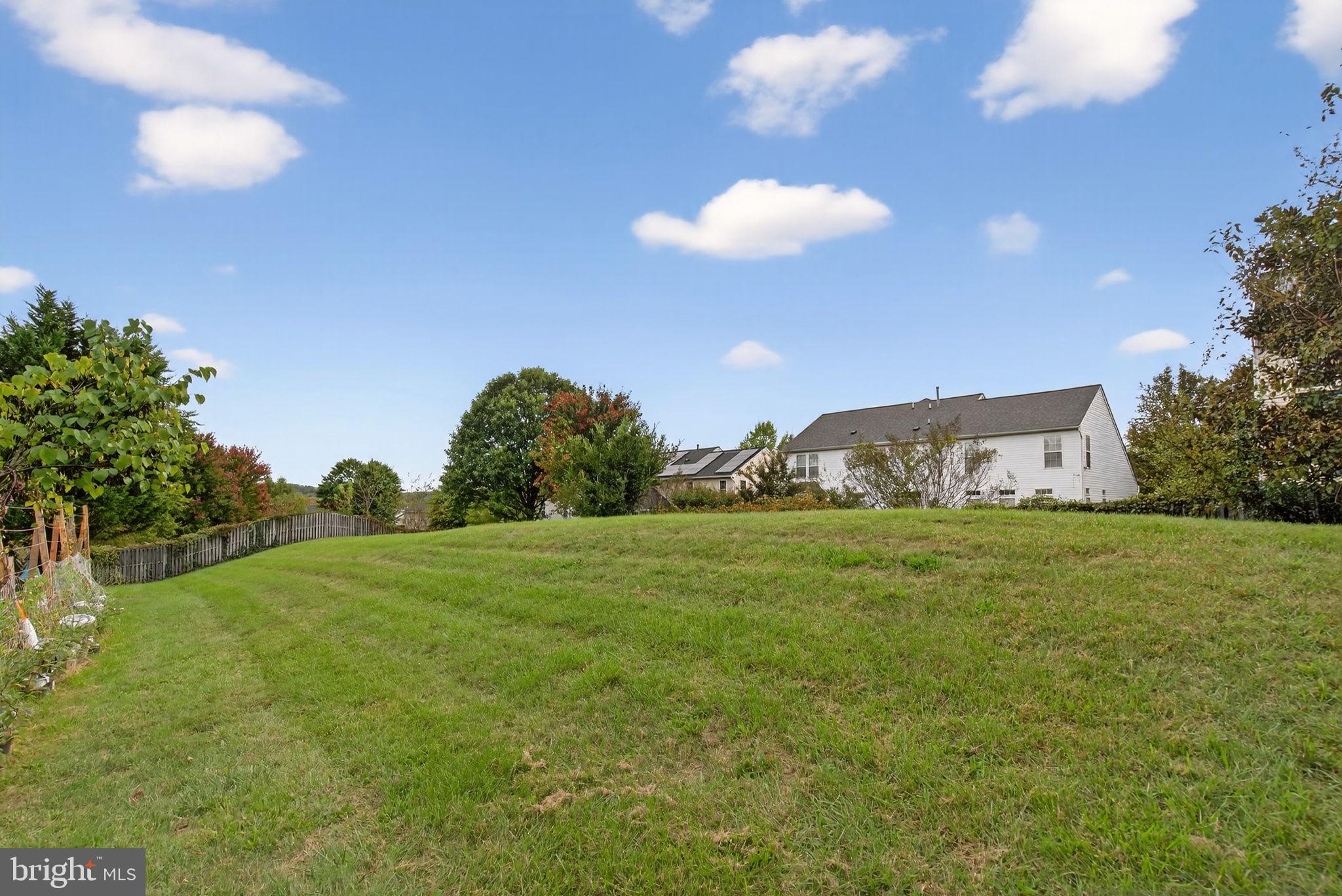 6903 Bock Road Fort Washington, MD 20744 - Photo 9 of 62 a view of a big yard with an outdoor space and seating