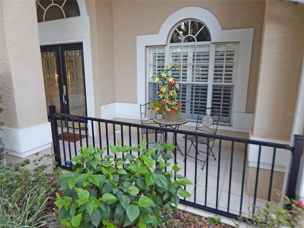 3603 Cypress Meadows Road Tampa, FL 33624 - Photo 2 of 33 a front view of a house with a yard