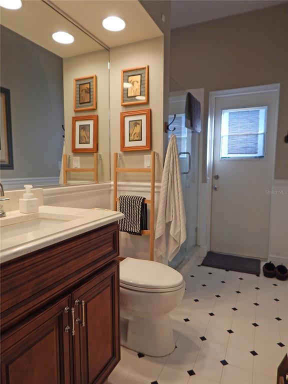3603 Cypress Meadows Road Tampa, FL 33624 - Photo 26 of 33 a bathroom with a sink toilet and shower