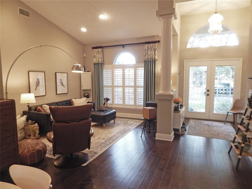 3603 Cypress Meadows Road Tampa, FL 33624 - Photo 4 of 33 a living room with furniture and a large window