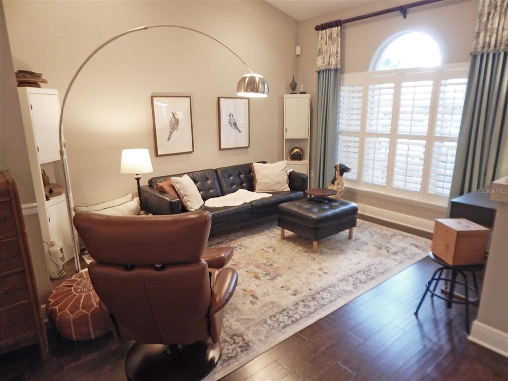 3603 Cypress Meadows Road Tampa, FL 33624 - Photo 5 of 33 a living room with furniture and a large window