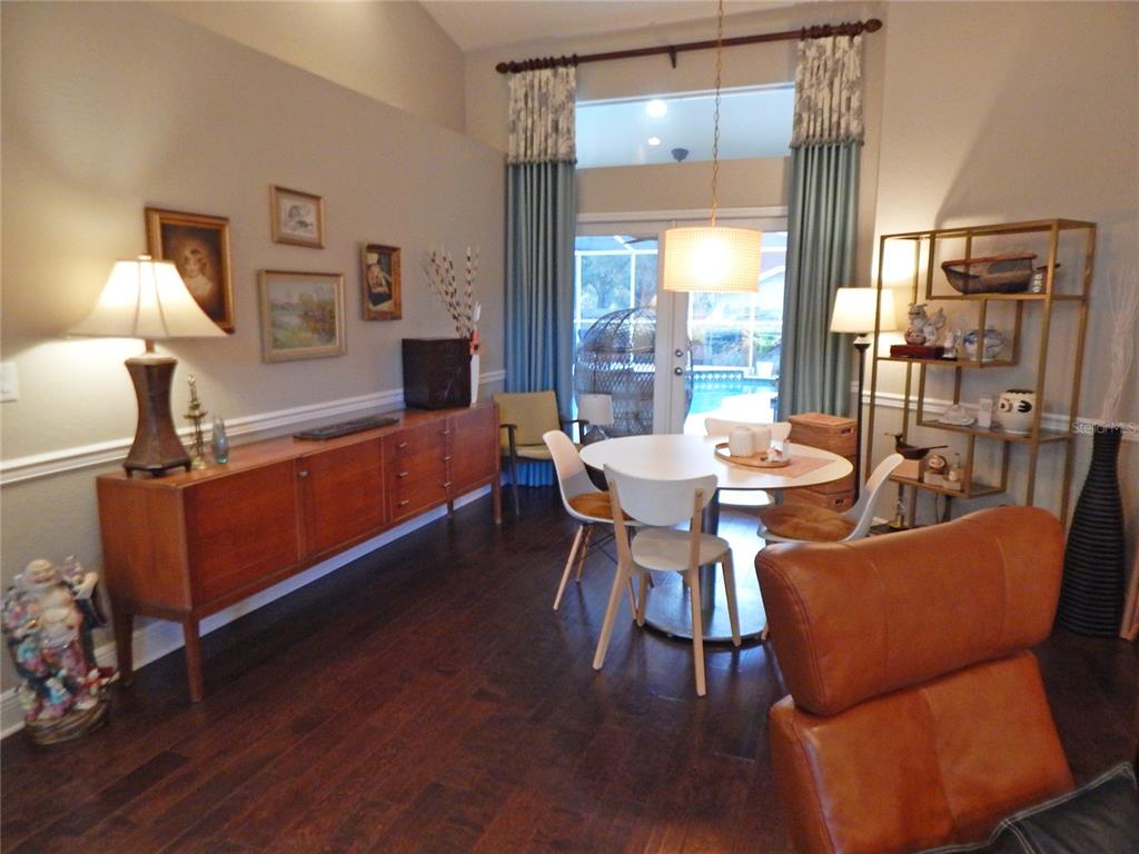 3603 Cypress Meadows Road Tampa, FL 33624 - Photo 6 of 33 a dining room with furniture and wooden floor