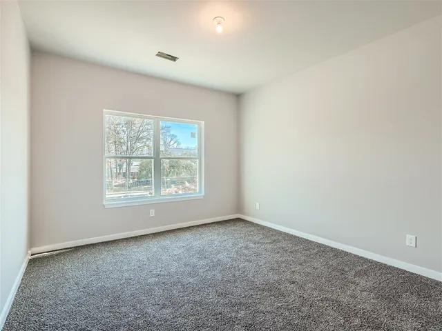 a view of a kitchen with wooden floor and a sink
