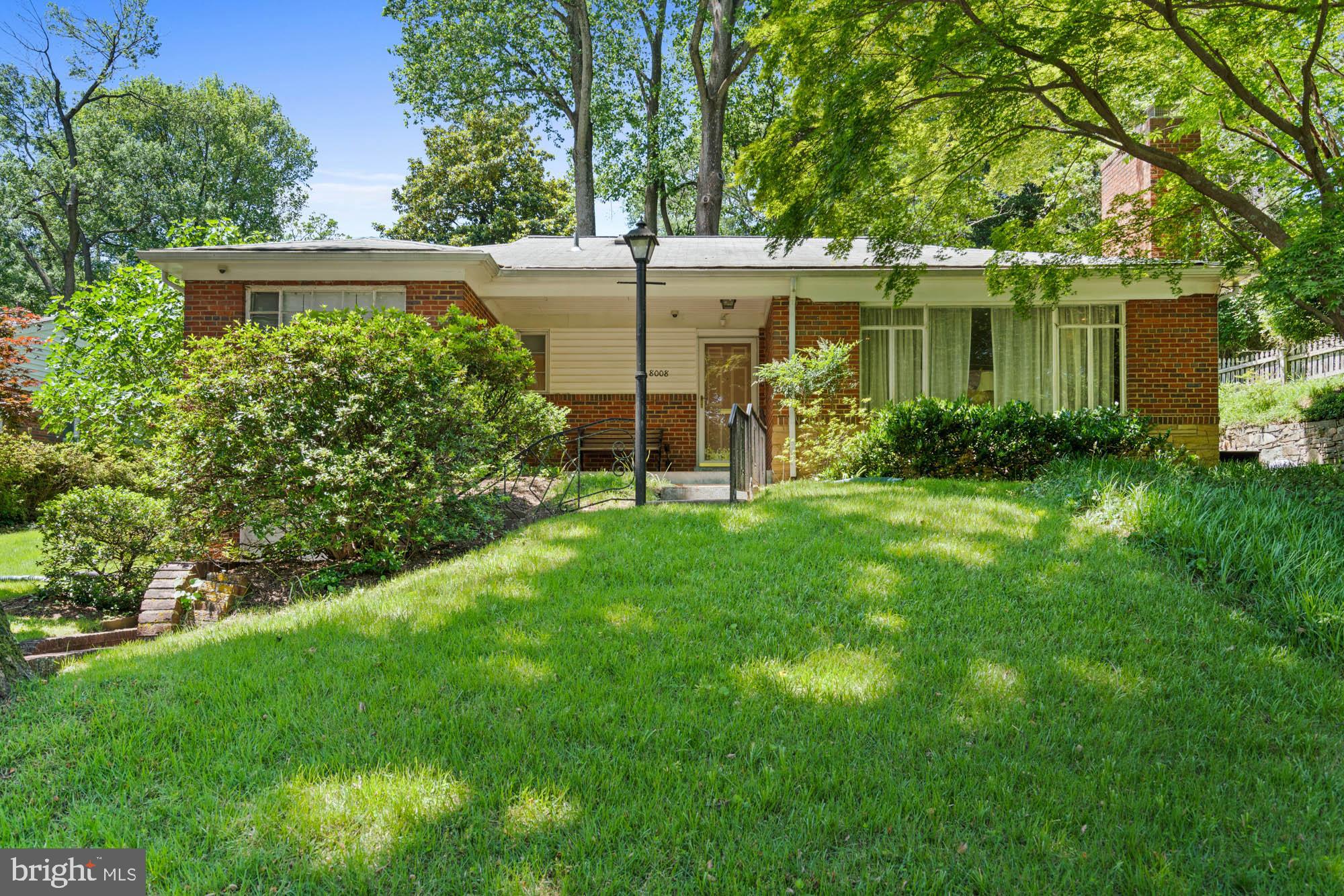 8008 Park Crest Drive Silver Spring, MD 20910 - Photo 5 of 42 a view of a house with a yard next to a lake