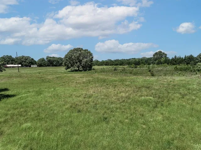 a view of a golf course with a lake