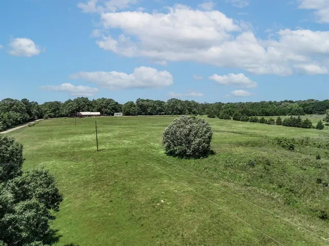 a view of a lake with houses in the back