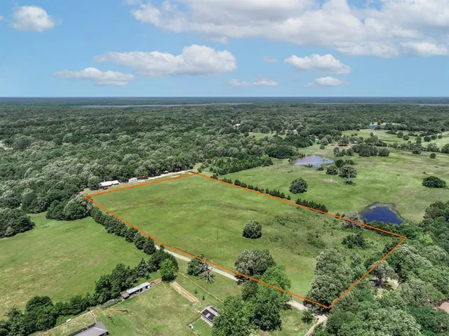 an aerial view of a golf course with an outdoor space