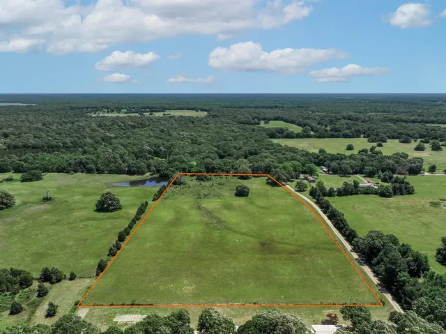 an aerial view of a golf course with swimming pool