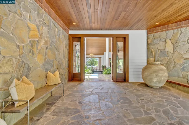 a view of front door and potted plants