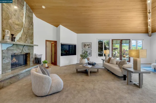 a living room with furniture and a lamp