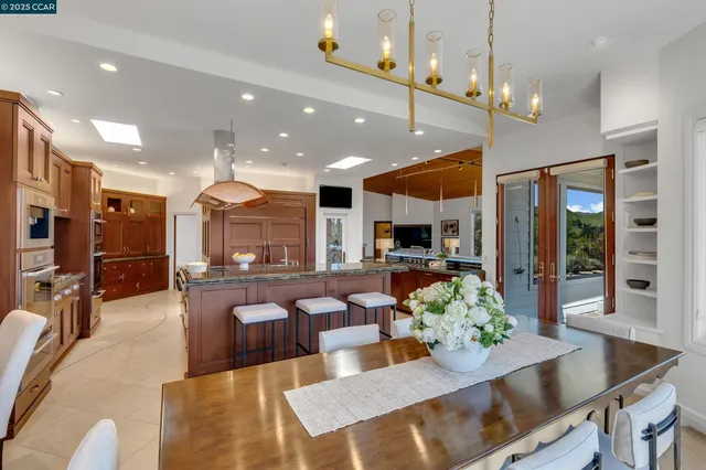 a kitchen with a refrigerator a sink and cabinets