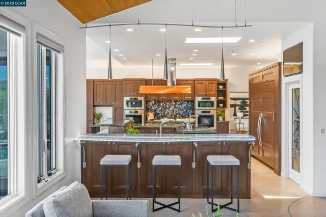 a view of a kitchen with a large window