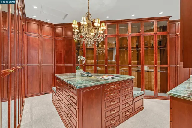 a spacious bedroom with a bed and a fireplace