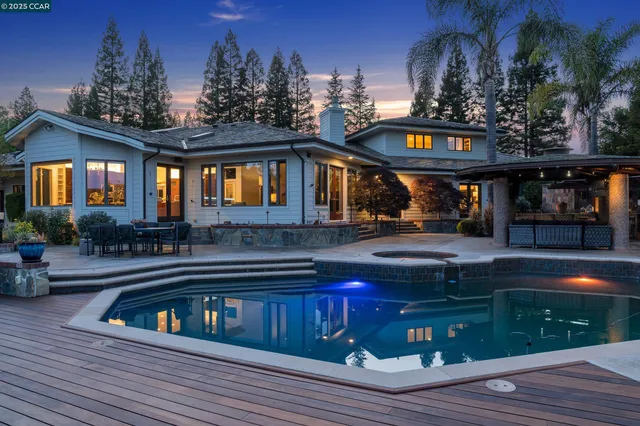 a view of building with cars parked