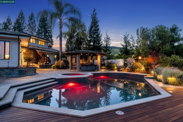 a view of swimming pool with a lounge chairs