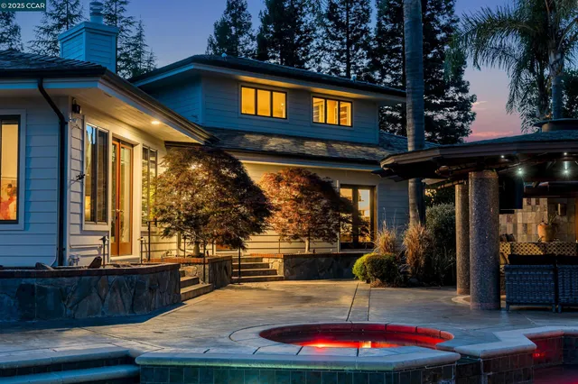 a view of a terrace with couches and wooden floor