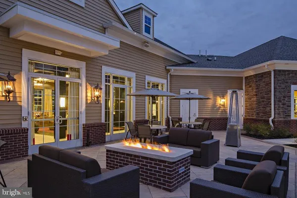 a outdoor living space with furniture and a potted plant