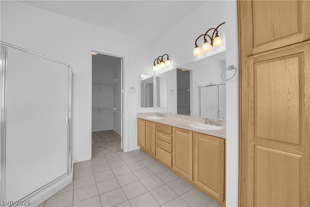 2184 Waterton Rivers Drive Henderson, NV 89044 - Photo 21 of 53 Primary Bathroom with Dual Sinks, Garden Tub, and Separate Shower