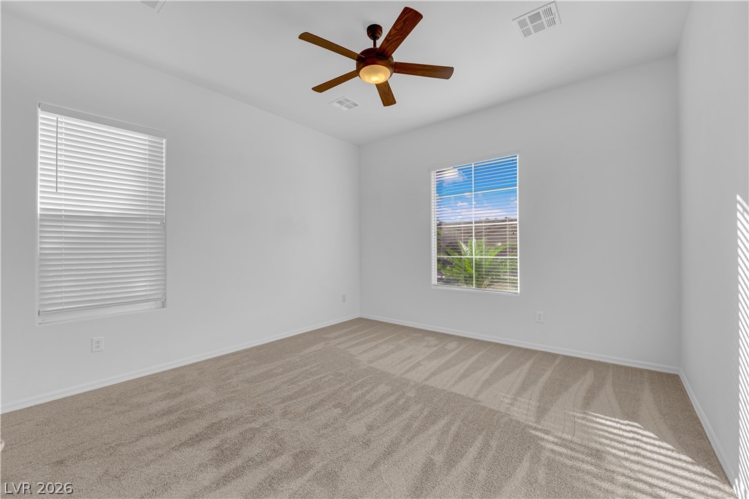 2184 Waterton Rivers Drive Henderson, NV 89044 - Photo 26 of 53 Secondary Bedroom Suite features Ceiling Fan and Private Bathroom with Tub/Shower Combination