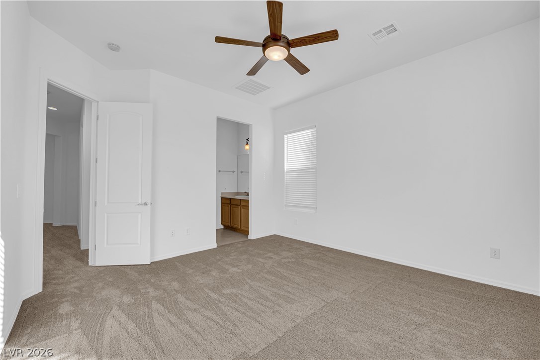 2184 Waterton Rivers Drive Henderson, NV 89044 - Photo 27 of 53 Secondary Bedroom Suite features Ceiling Fan and Private Bathroom with Tub/Shower Combination