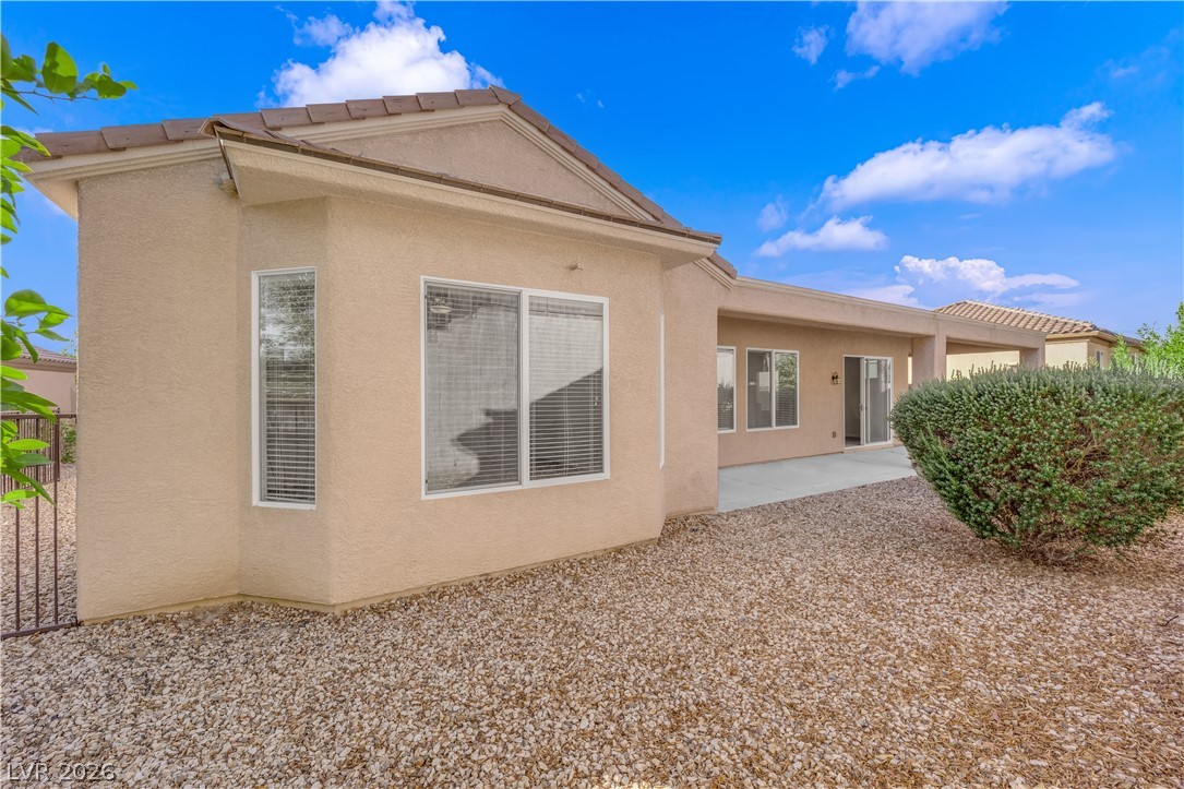 2184 Waterton Rivers Drive Henderson, NV 89044 - Photo 34 of 53 Fully Fenced Rear Yard with Covered Patio and Gas Barbecue Stub