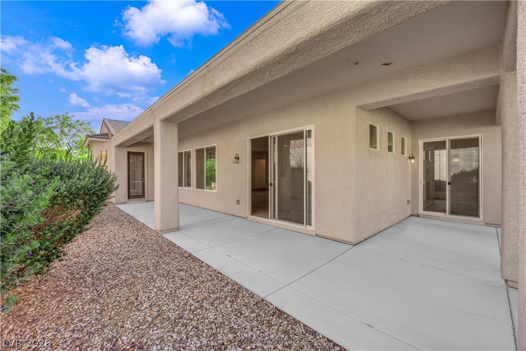2184 Waterton Rivers Drive Henderson, NV 89044 - Photo 36 of 53 Fully Fenced Rear Yard with Covered Patio and Gas Barbecue Stub
