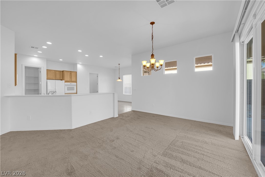 2184 Waterton Rivers Drive Henderson, NV 89044 - Photo 5 of 53 Formal Dining Area with Sliding Glass Door to the Patio & Backyard