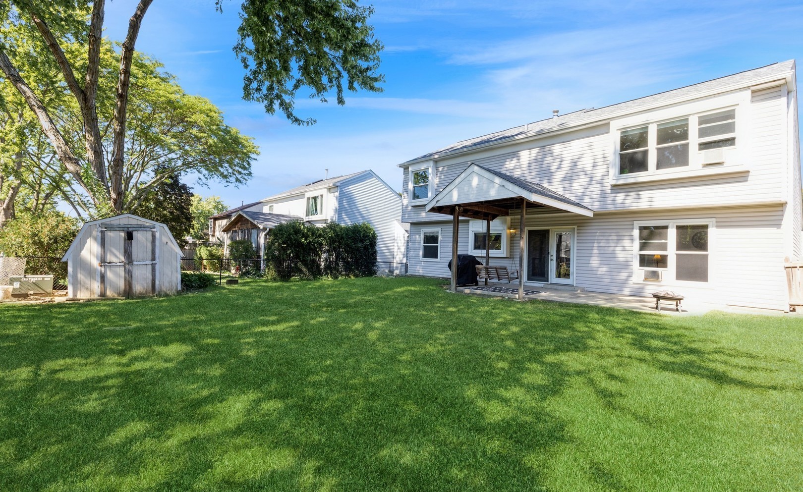 3256 Gresham Lane East Aurora, IL 60504 - Photo 14 of 14 a view of a house with a yard and porch