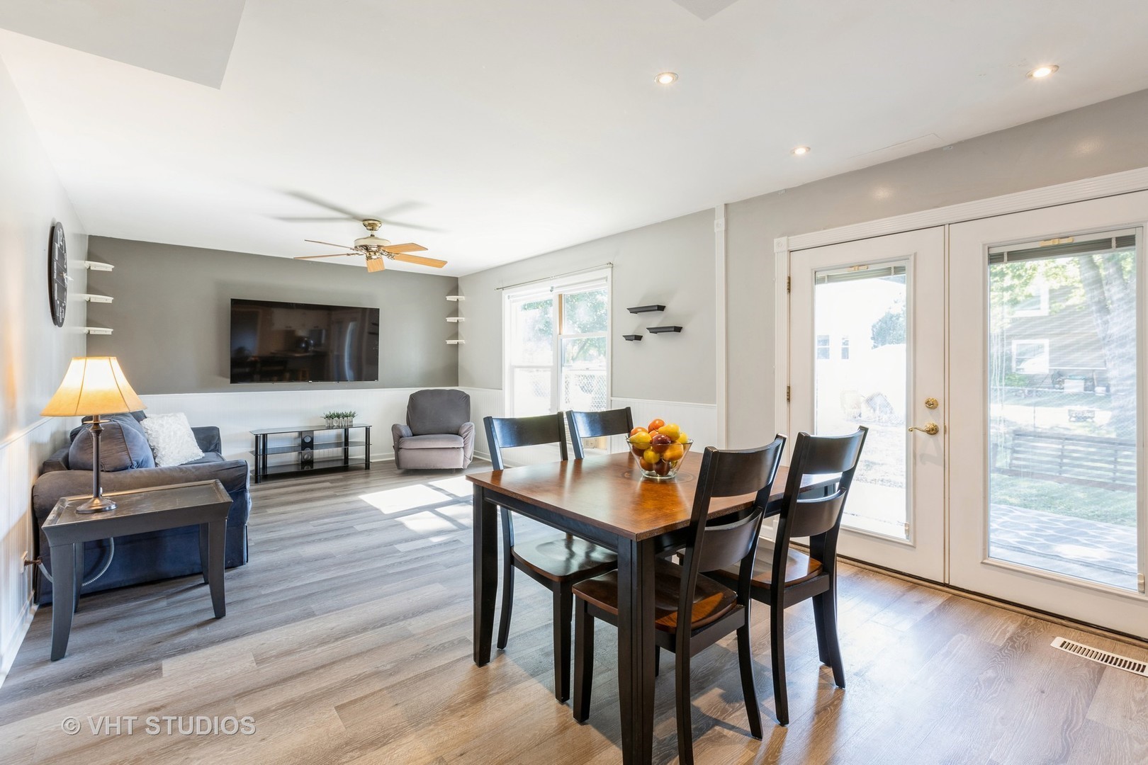 3256 Gresham Lane East Aurora, IL 60504 - Photo 6 of 14 a living room with furniture a flat screen tv and wooden floor